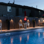 Beautiful backyard swimming pool in Ontario heated by an energy-efficient pool heater system comparing natural gas, electric, and heat pump options.