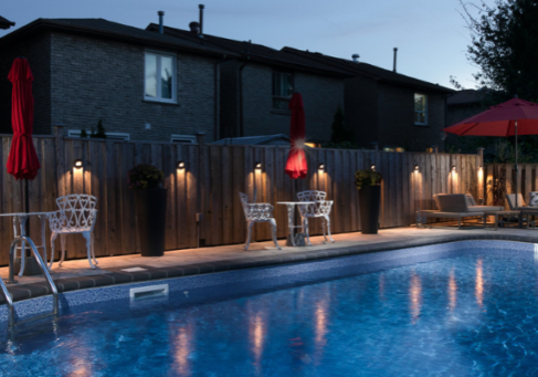 Beautiful backyard swimming pool in Ontario heated by an energy-efficient pool heater system comparing natural gas, electric, and heat pump options.